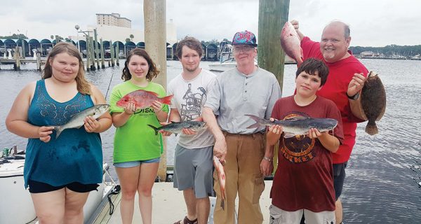 The Barnes family braved some rough seas and tough conditions with Capt. Tew aboard the Kitchen Pass but still had a great time.