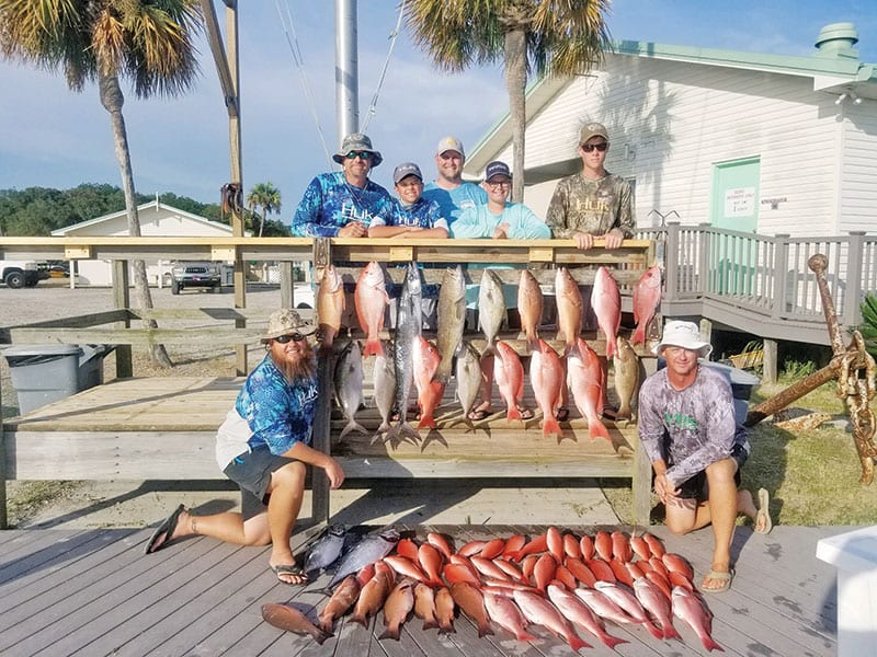 The Sawyer family with a great haul aboard the Kitchen Pass.