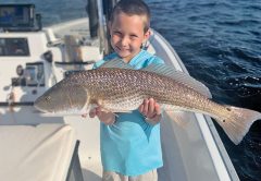 The kids are all smiles when fishing with Capt. Garrison and Reel Rosie Charters.