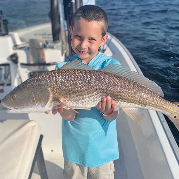 The kids are all smiles when fishing with Capt. Garrison and Reel Rosie Charters.