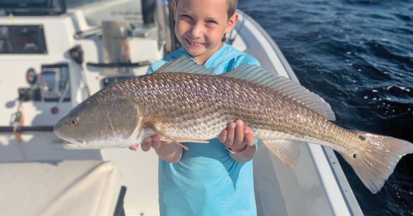 The kids are all smiles when fishing with Capt. Garrison and Reel Rosie Charters.
