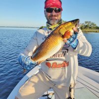 The reds in St. Andrews Bay’s stained water have turned a stunning shade of gold! And those Fish Monkey gloves are legit...