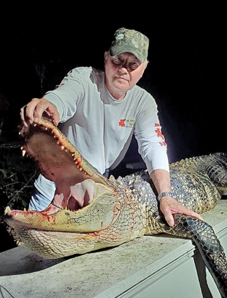 Vern Ward with his 9 ft., 350 lb. Washington County gator.