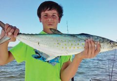 Dylan Shingler catching monster Spanish with Dad.