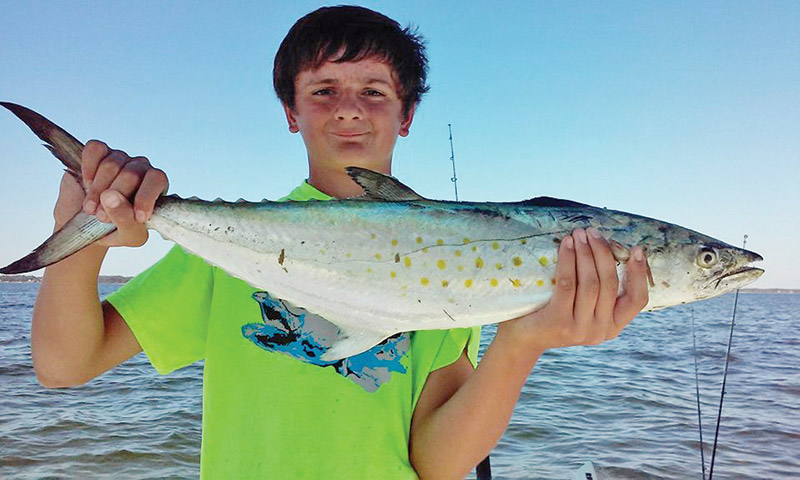 Dylan Shingler catching monster Spanish with Dad.