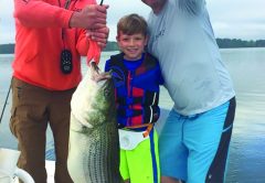 G C Lewis of Newnan, Ga brings his 8-year-old out for first time and young Lewis boats a 35 pounder