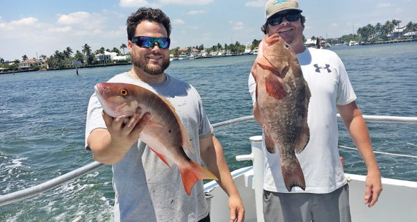 Clint and Jesse with a nice mutton snapper and red grouper caught on Catch My Drift