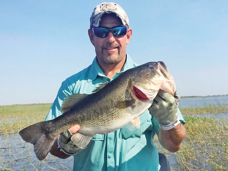 Capt Neal Stark with a  Lake Okeechobee Bass.