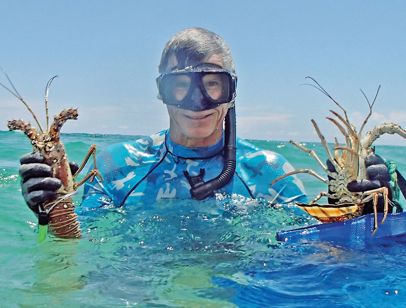 Capt Chad with a few spiny lobsters.