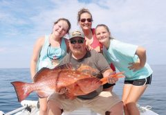 Blake family with a nice red grouper on the Adrenaline boat.