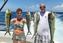 Chaylene with a nice catch of dolphin fishing with New Lattitude Sportfishing.