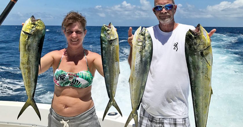 Chaylene with a nice catch of dolphin fishing with New Lattitude Sportfishing.