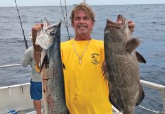 Greg with a nice kingfish and grouper caught aboard Catch My Drift.