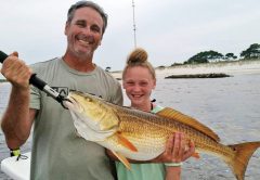 James McLain and daughter Kyra of Panama City with a monster!