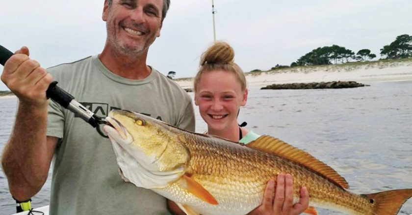 James McLain and daughter Kyra of Panama City with a monster!