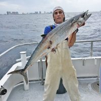 Kyle with a nice kingfish caught drift fishing with Fishing Headquarters.