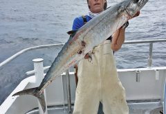 Kyle with a nice kingfish caught drift fishing with Fishing Headquarters.