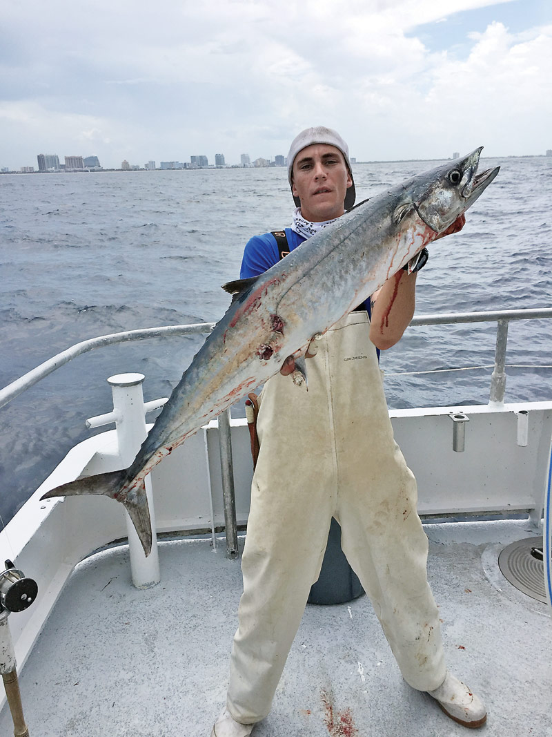 Kyle with a nice kingfish caught drift  fishing with Fishing Headquarters.