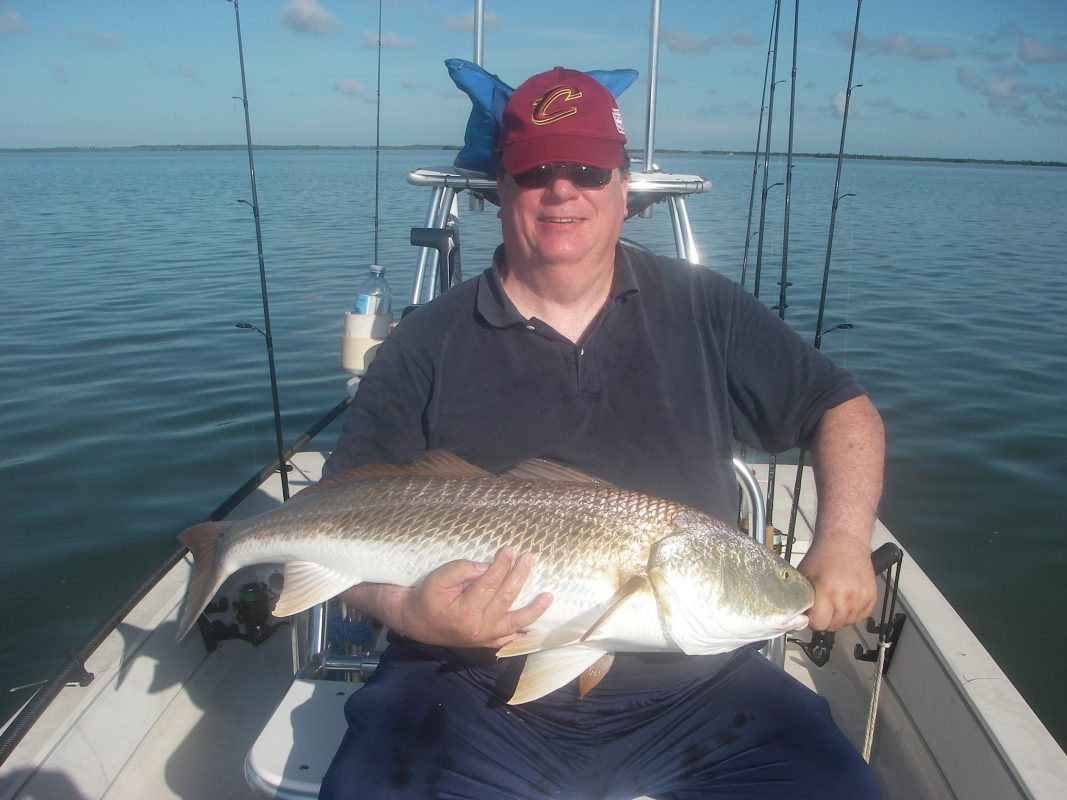 Ed caught a personal best redfish recently with Capt. Mark Wright. He plucked this breeder out of a group of fifty fish as they actively fed on schooling mullet!