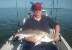 Ed caught a personal best redfish recently with Capt. Mark Wright. He plucked this breeder out of a group of fifty fish as they actively fed on schooling mullet!