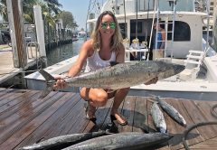 Ashlee with some big kingfish caught on a Fishing Headquarters charter.