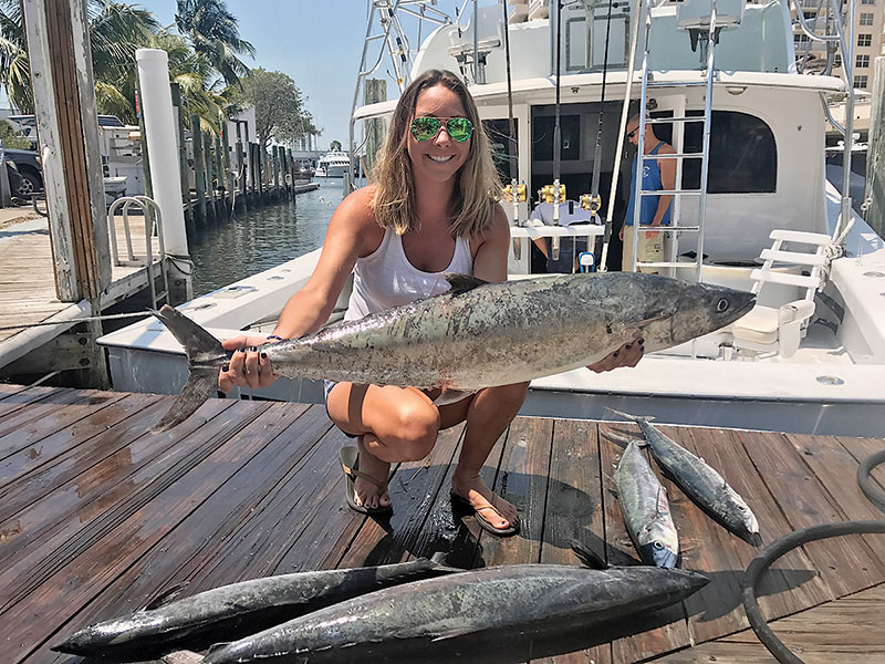 Ashlee with some big kingfish caught on a Fishing Headquarters charter.