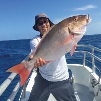 Orlando with a slob mutton snapper caught aboard the Catch My Drift.