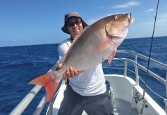 Orlando with a slob mutton snapper caught aboard the Catch My Drift.
