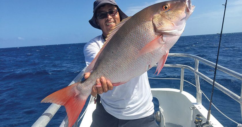 Orlando with a slob mutton snapper caught aboard the Catch My Drift.