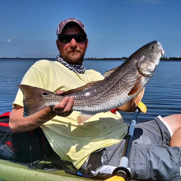 Captain William Hawley with a gorgeous 26 inch slot red caught on live shrimp near Grant