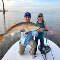 Jerad Merbitz and daughter Liana with their redfish on the NIRL.
