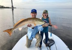Jerad Merbitz and daughter Liana with their redfish on the NIRL.