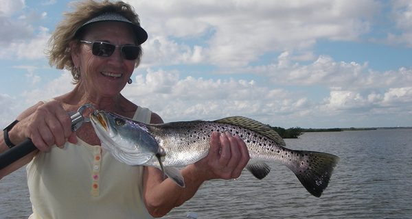 Brenda’s smile says it all! Live shrimp under a float allowed her to catch several trout and redfish recently with Capt. Mark Wright.