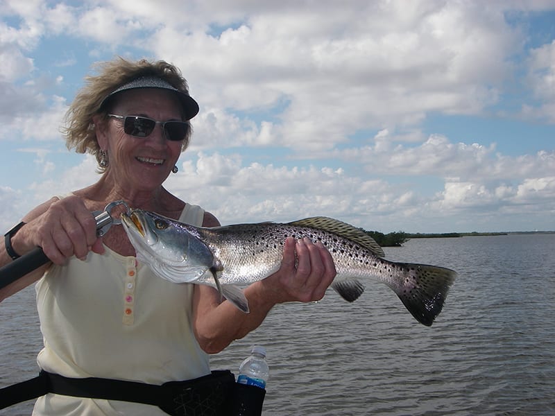 Brenda’s smile says it all! Live shrimp under a float allowed her to catch several trout and redfish recently with Capt. Mark Wright.