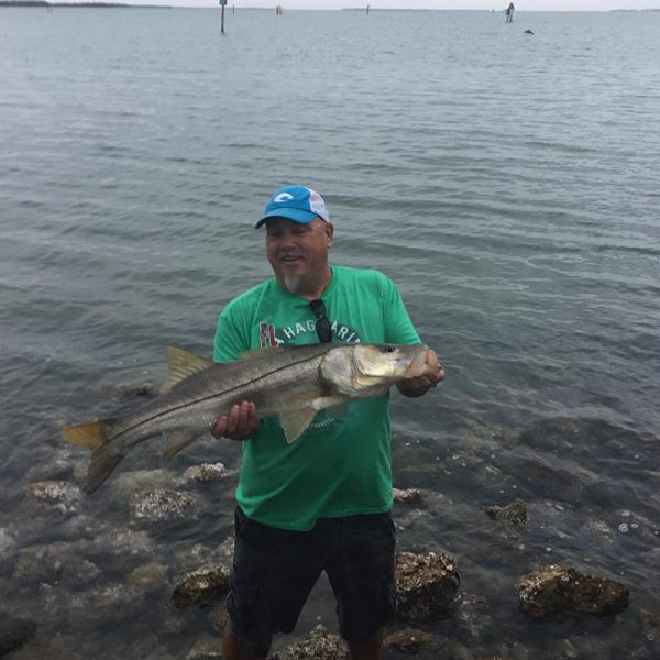 Joe Sheaffer w/ a nice snook, quickly getting her back in the water, Placida pier