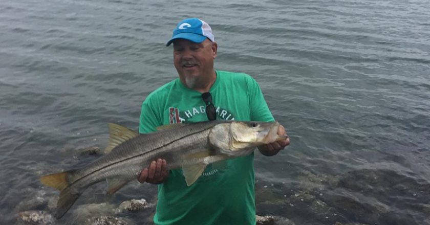 Joe Sheaffer w/ a nice snook, quickly getting her back in the water, Placida pier