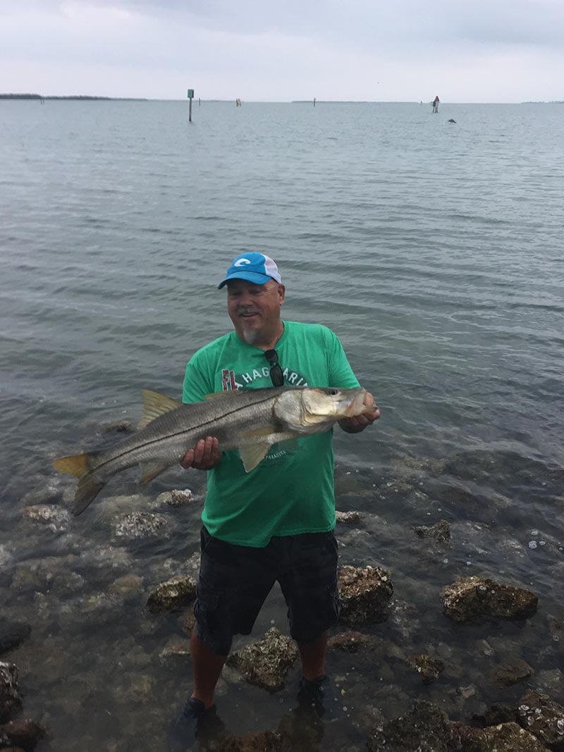 Joe Sheaffer w/ a nice snook, quickly getting her back in the water, Placida pier