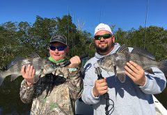 Charlie “the fish slayer” and his dad Chuck, with a beautiful pair of black drum.
