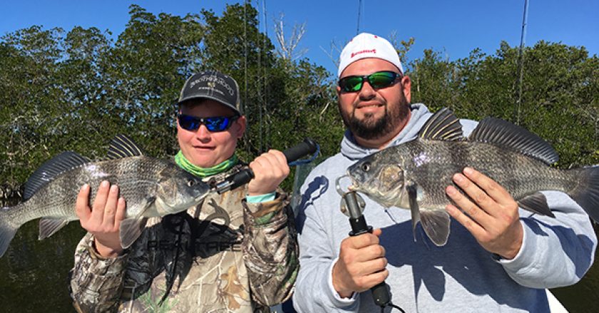 Charlie “the fish slayer” and his dad Chuck, with a beautiful pair of black drum.