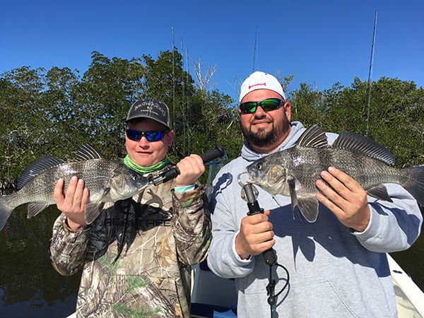 Charlie “the fish slayer” and his dad Chuck, with a beautiful pair of black drum.