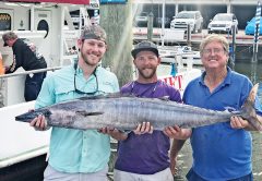 Capt Paul and Josh with a big wahoo caught with Fishing Headquarters.