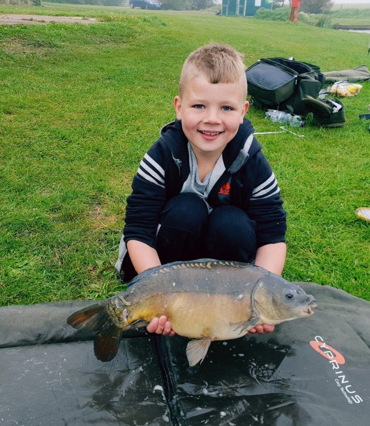 Riley with carp fish | Coastal Angler & The Angler Magazine