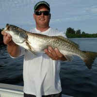 Mike Barker, owner of The Chum Buddy, showing off his first ever speckled trout.
