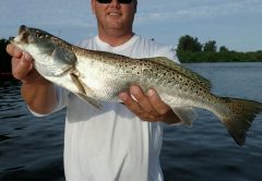 Mike Barker, owner of The Chum Buddy, showing off his first ever speckled trout.