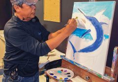 Carey Chen directs artists at the 2018 Canvas & Cocktails event