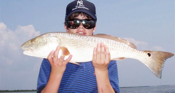 12 yr. old Jason Dengle from Texas caught his first homosassa redfish while out w Capt. Rick.