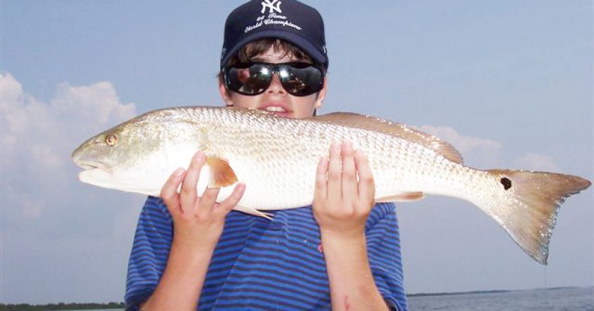 12 yr. old Jason Dengle from Texas caught his first homosassa redfish while out w Capt. Rick.