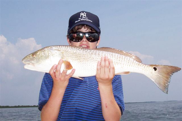 12 yr. old Jason Dengle from Texas caught his first homosassa redfish while out w Capt. Rick.