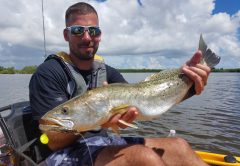 Big trout like this one caught with LocalLinesCharters.com get happy when it cools and the mullet move.