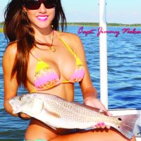 Luiza shows off a nice Redfish. For more information on this amazing lady angler, go to: www.fishingwithluiza.com
